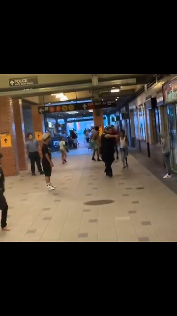 Police officer pulls gun on small child who is attacking with a knife.