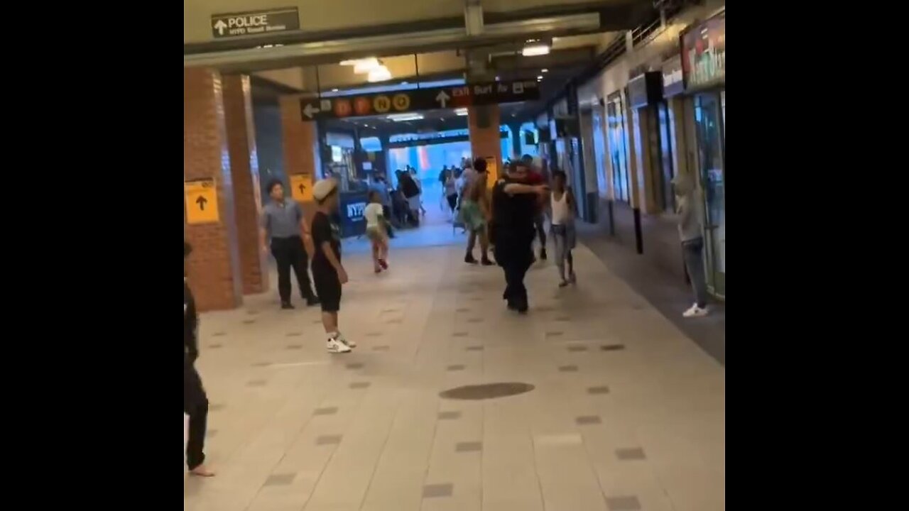 Police officer pulls gun on small child who is attacking with a knife.