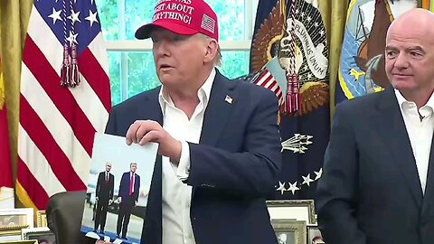 Trump proudly shows off his photo with Putin in front of American journalists.
