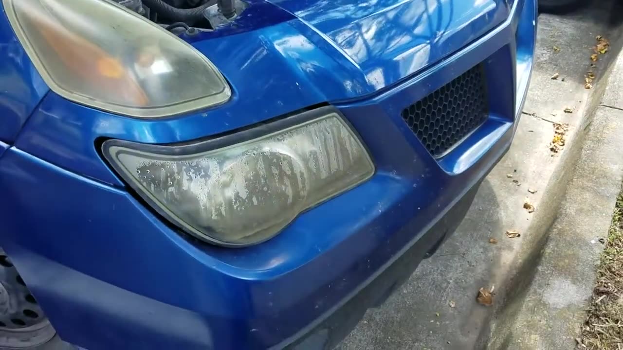 Replace headlight bulb 2003 Pontiac Aztek