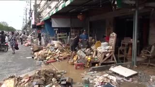 Rescuers struggle to find survivors after devastating floods and landslides