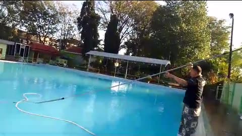 "Cleaning the Swimming Pool with a Vacuum: The Secret to Clear and Clean Water!"