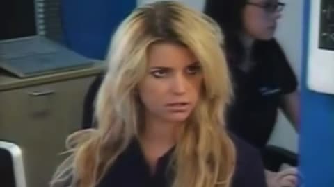 Jessica Simpson working at a computer store