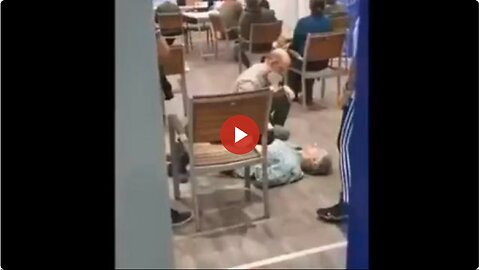 Jab center at the mall - Guy gets his jab, falls over dead - sheeple just sit there
