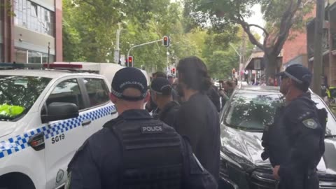 NSW Police Raptor Squad arrest March for Australia attendee for open mic speech as bystanders boo and yell "traitors".