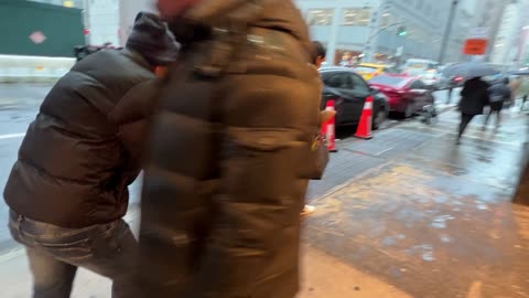 An illegal African man approches the NGO Hotel for a pass to go inside.