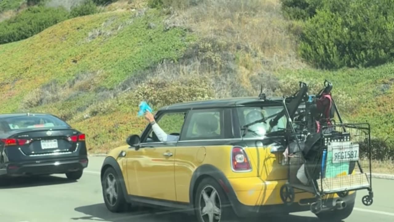 Man Blows Bubbles Out Car Window