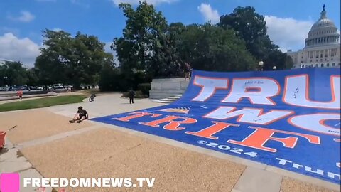 A massive "Trump Won Trifecta" flag is being unfurled in front of the Capitol in Washington DC.