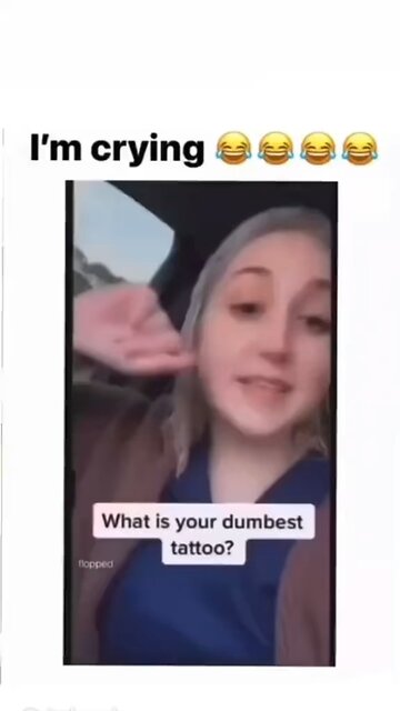 A tattoo of a sword with titties