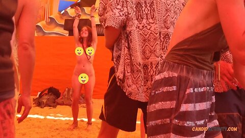 Hippie redhead dancing naked at festival