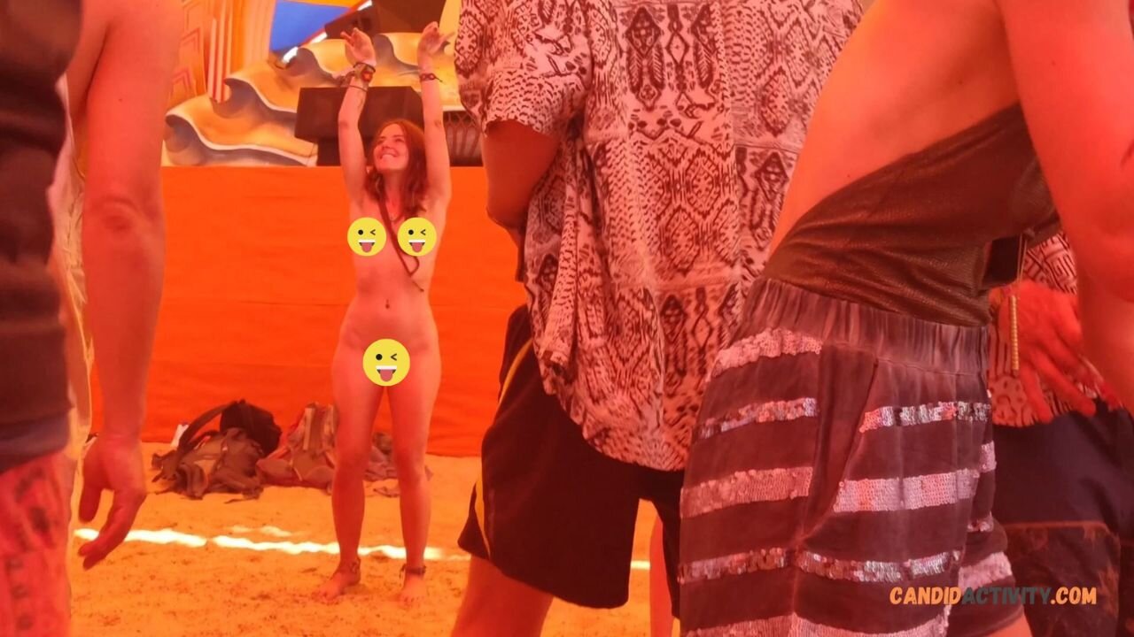 Hippie redhead dancing naked at festival
