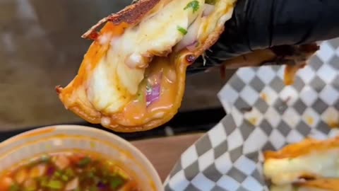 Taco with loaded beef and melting cheese, who could rejecting that?