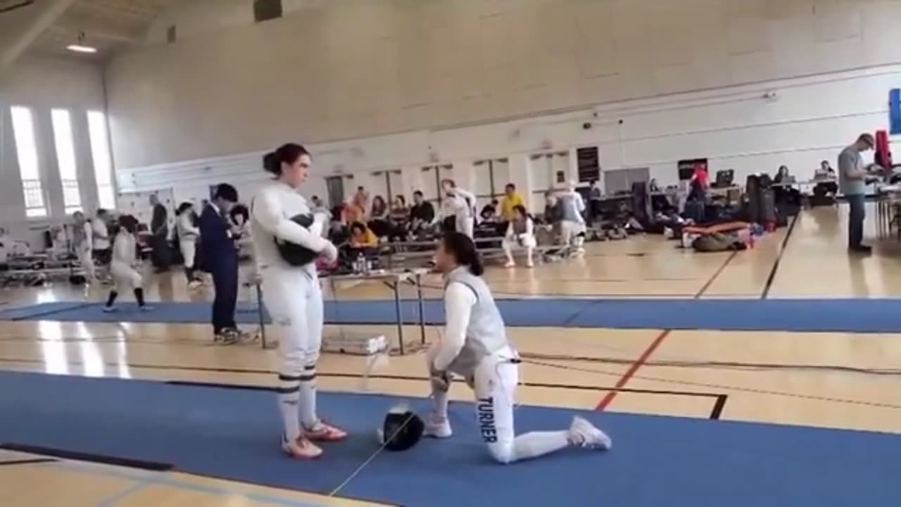 Female fencer takes knee at bout against trans opponent