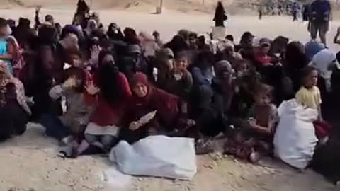 Women from Gaza sit on the floor at the GHF American-Israeli Relief Center in Rafah this morning. They greet security guards. Waiting to receive aid.
