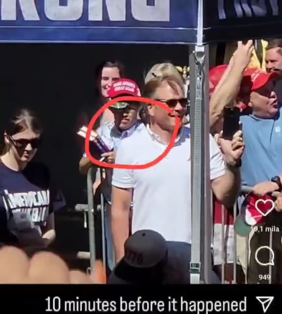 10 minutes before the "shot" - Charlie Adjusts The Blood Squib's Fat Unclipped Hose (not a mic)