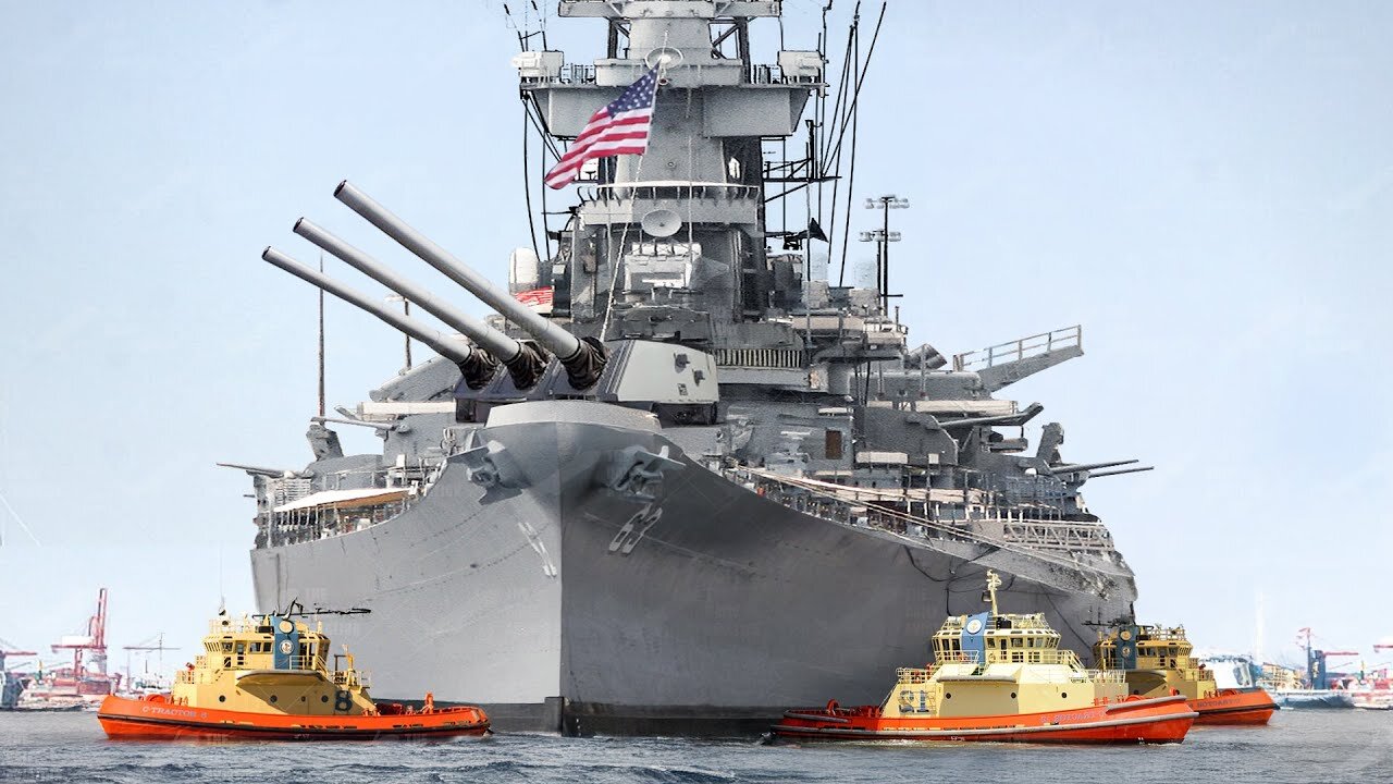 US Massive Battleship Taken into Port by Fleet of Powerful Tugboats
