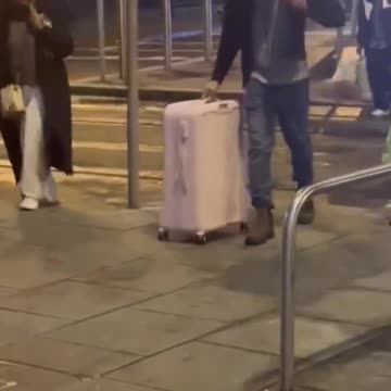 A large group of migrants arrives in Dublin, Ireland, at a nice hotel prepared for them.