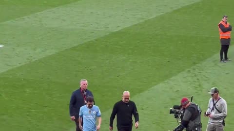 Pep Guardiola Waves to the Manchester United Fans Booing Him