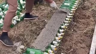 Using beer bottles to build a wall!.hd
