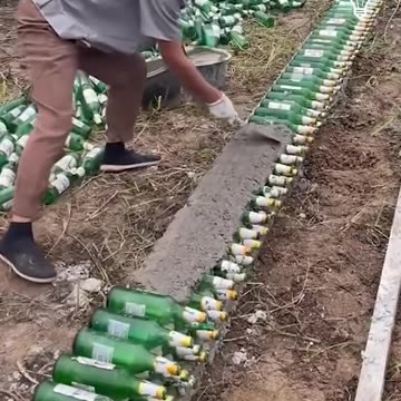 Using beer bottles to build a wall!.hd