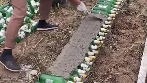 Using beer bottles to build a wall!.hd