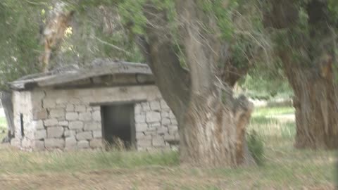 Quonset hut, or half of one, and old brick building!
