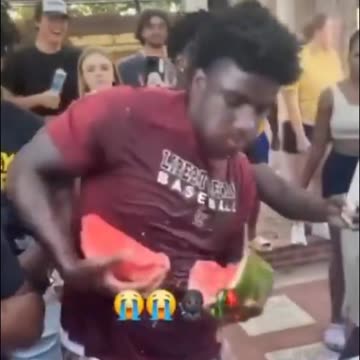 Man rips a watermelon apart like a superhero to win a watermelon eating competition