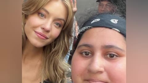 Sydney Sweeney takes a picture with a Hater