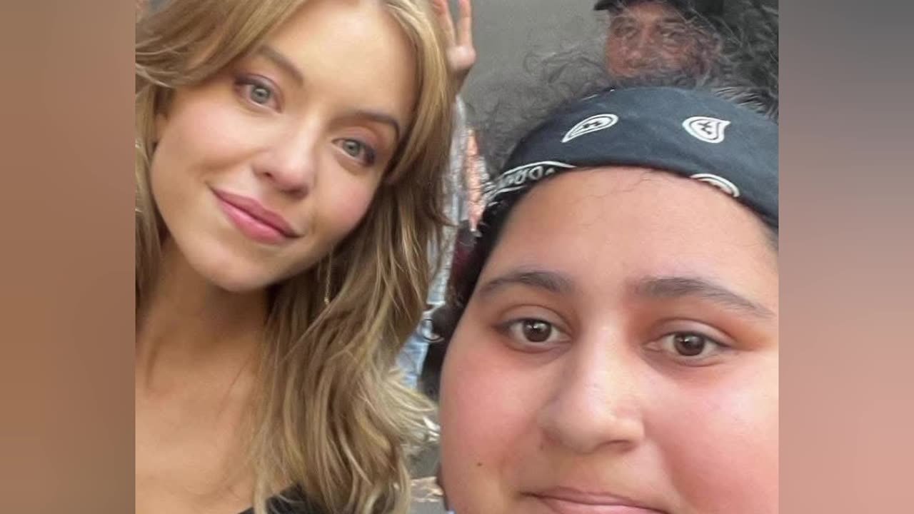 Sydney Sweeney takes a picture with a Hater