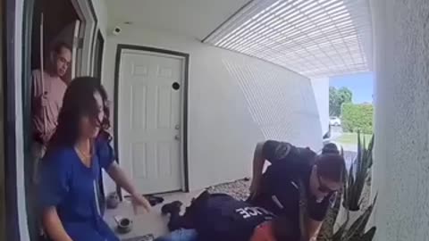 Video Shows Officer Confronted with Knife by Man in Front of Home