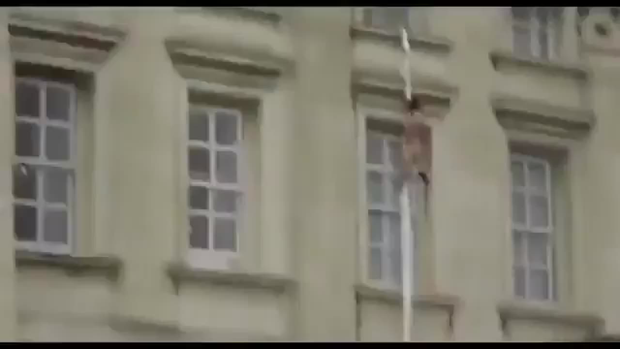 A naked person is seen climbing out the window of Buckingham Palace