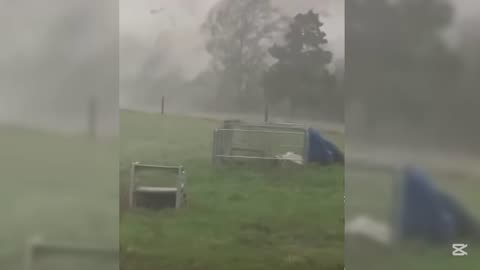 Tornado there's farm building in to the air