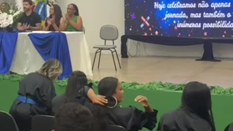 Two Playful Dogs Crash Graduation Ceremony