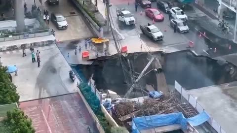 Massive sinkhole opens up in Bangkok, swallowing parts of a busy street