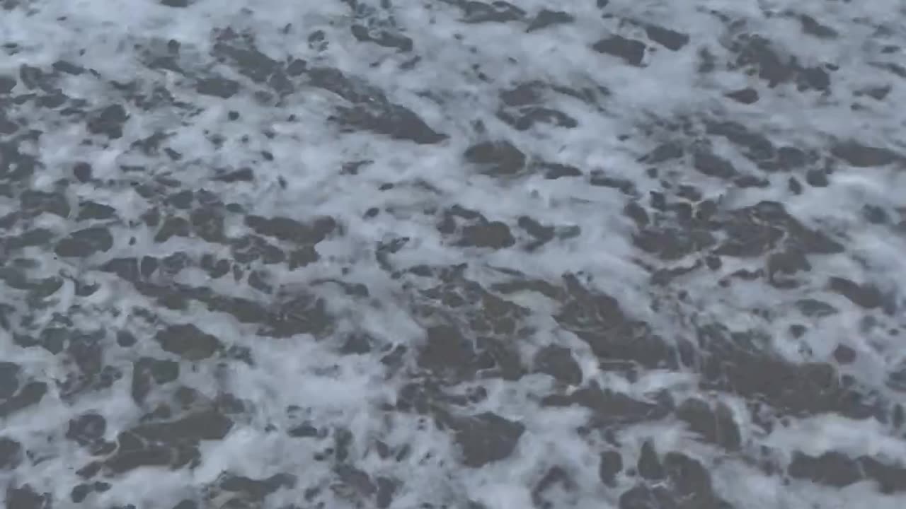 Woman Gets Soaked By Incoming Wave