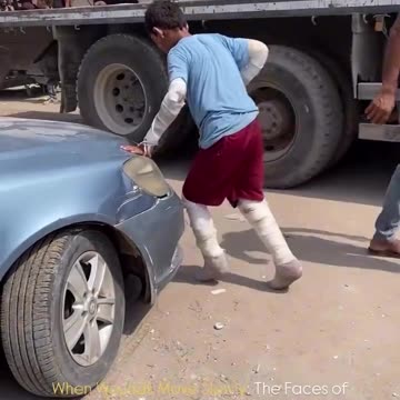 A child, gravely injured, struggles to move as both his legs and arms are wrapped in medical splints