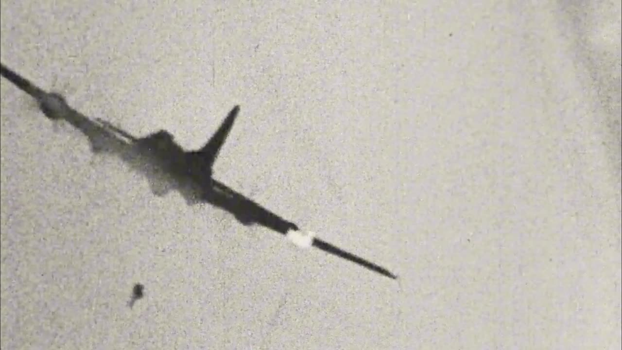 B-17 Flying Fortress drifts out of formation pursued by a Luftwaffe fighter