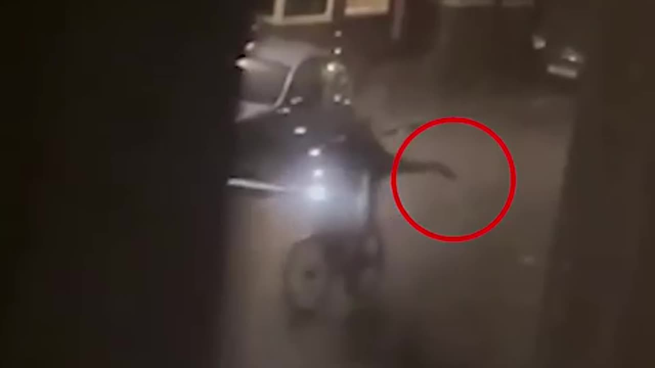 Cyclist__points_GUN_at_terrified_crowd_outside_homes__in_late-night_horror(480p).mp4