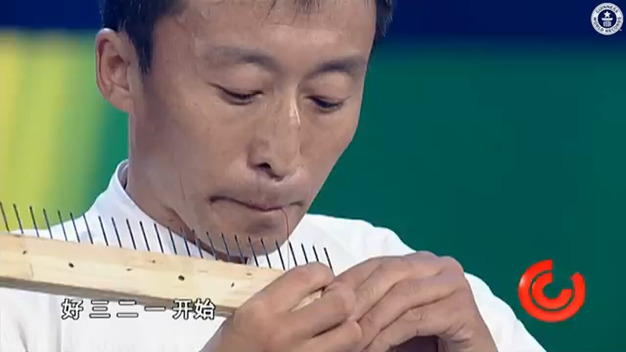Most Needles Threaded With The Mouth - Guinness World Records