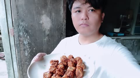 Mike is eating siomai