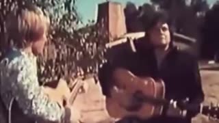 Johnny Cash and John Denver perform