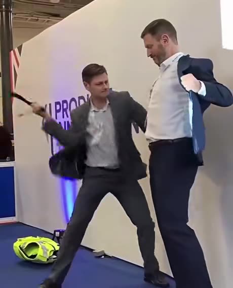 Body armour company demonstrates their stab proof vest on their CEO