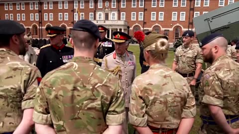 King Charles fires a cannon during visit to Royal Regiment