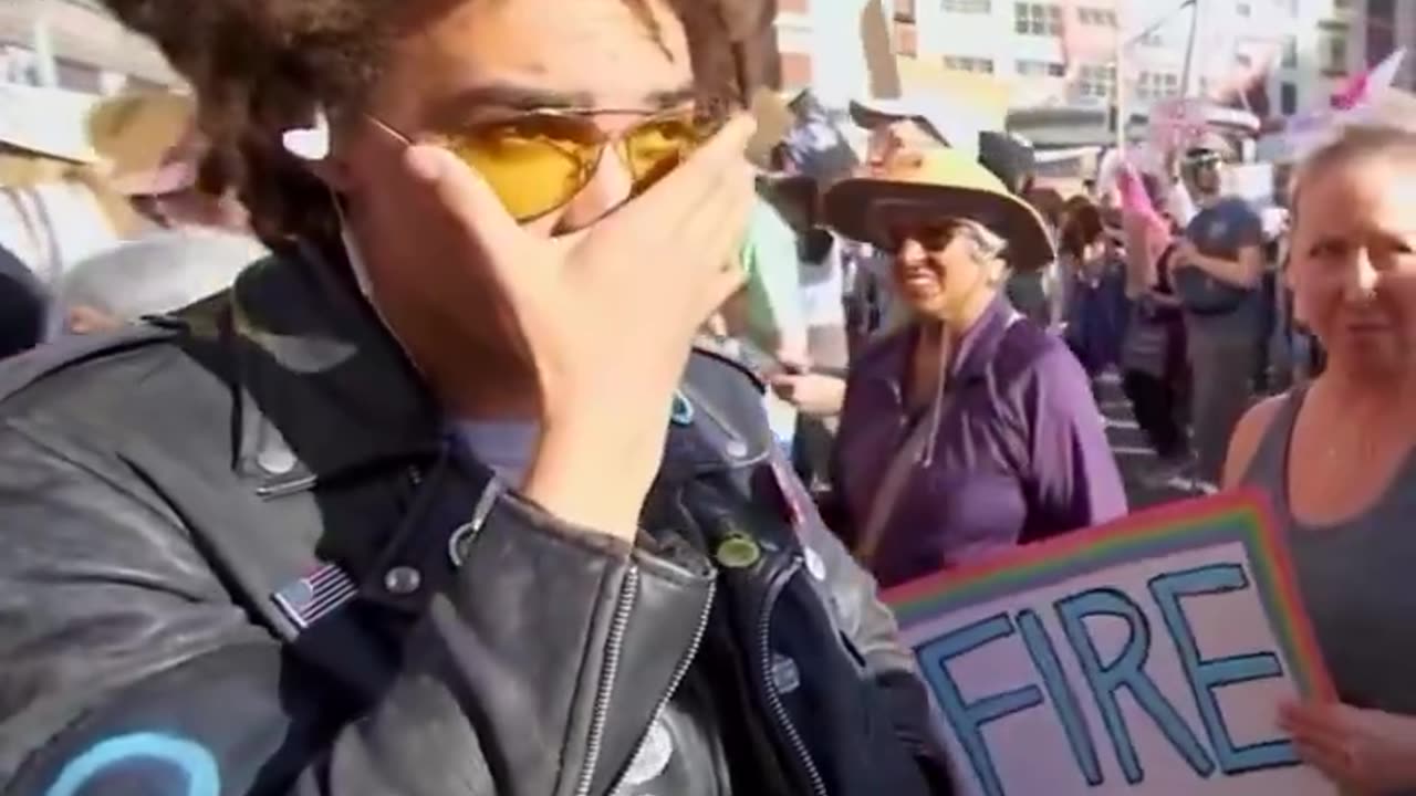 Angry, Explicit Leftist Duo at 'Hands Off' Gathering Can't Explain What Trump and Musk Did Wrong
