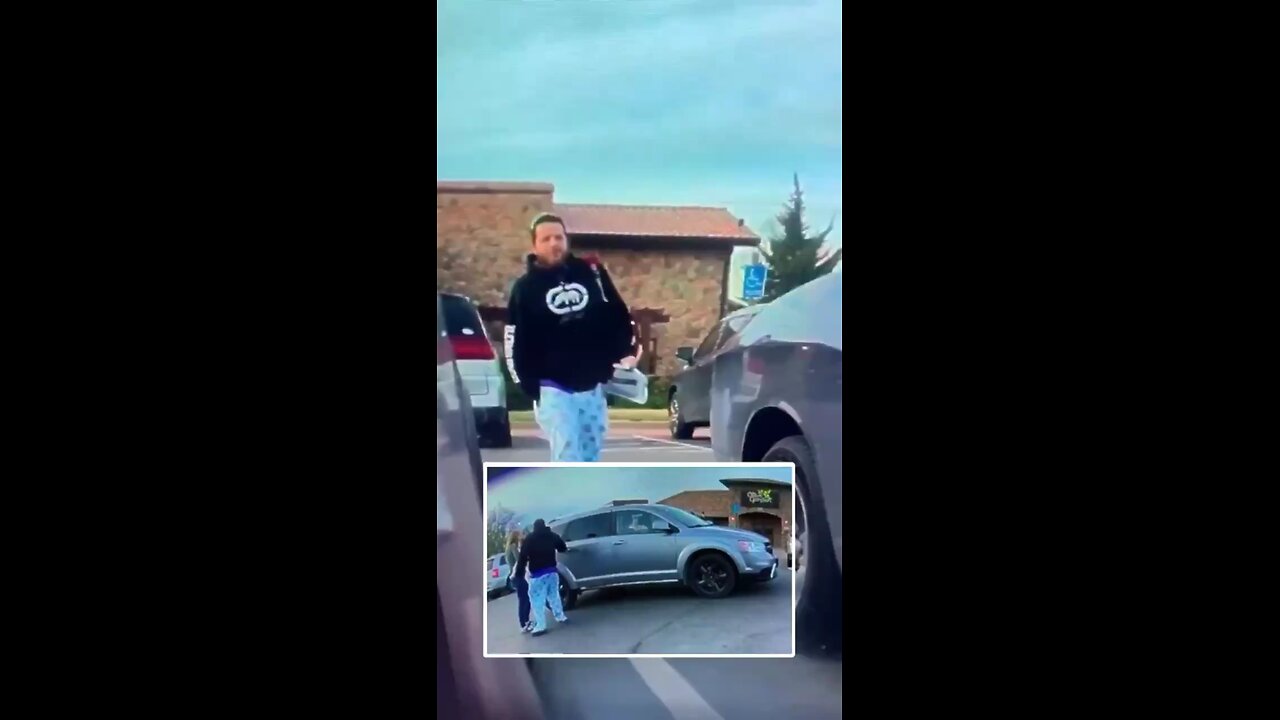 A man wearing pajamas was captured on video vandalizing a Tesla outside an Olive Garden in Wichita