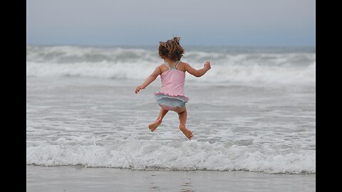 The baby is splashing in the water"
