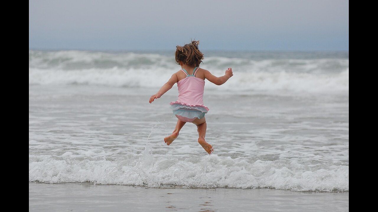 The baby is splashing in the water"