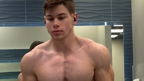 Handsome muscular man showing off his muscles