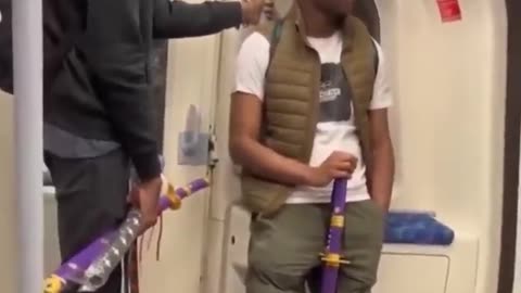 Teenagers openly carrying samurai swords on the london underground