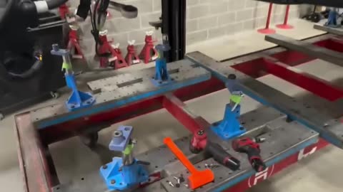 Tesla model 3 mounted on the Celette bench to ensure everything lines up correctly.
